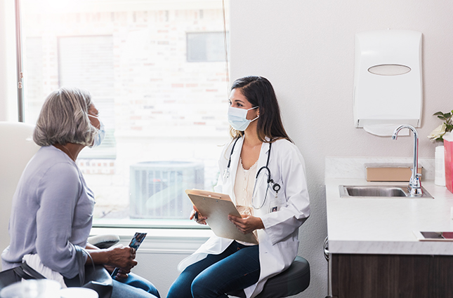 female doctor and patient in exam room