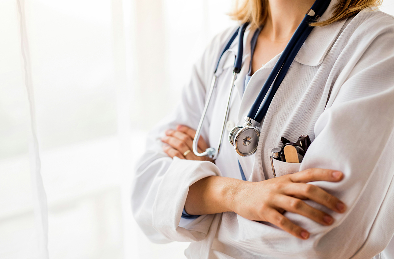 female doctor with arms folded
