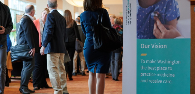 hallway full of physicians and meeting attendees