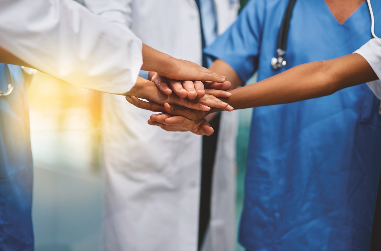 circle of hands placed together