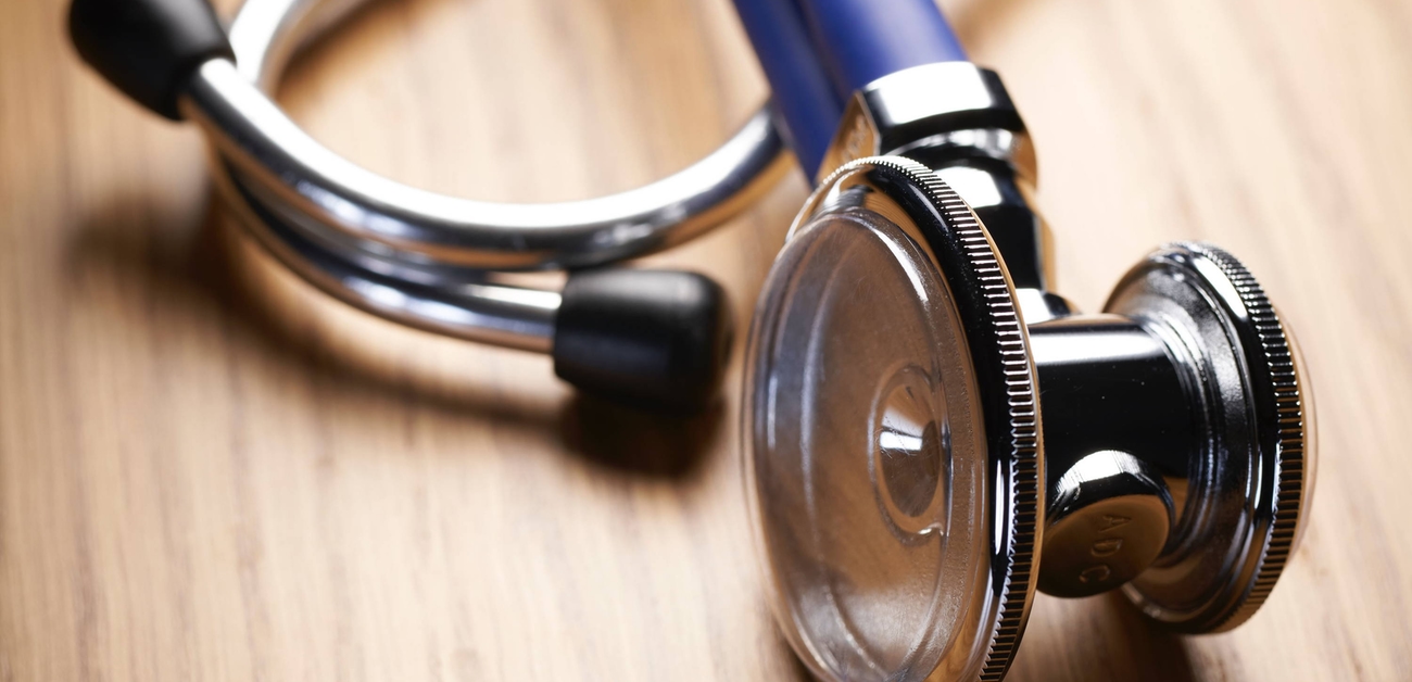 stethoscope on a wooden table