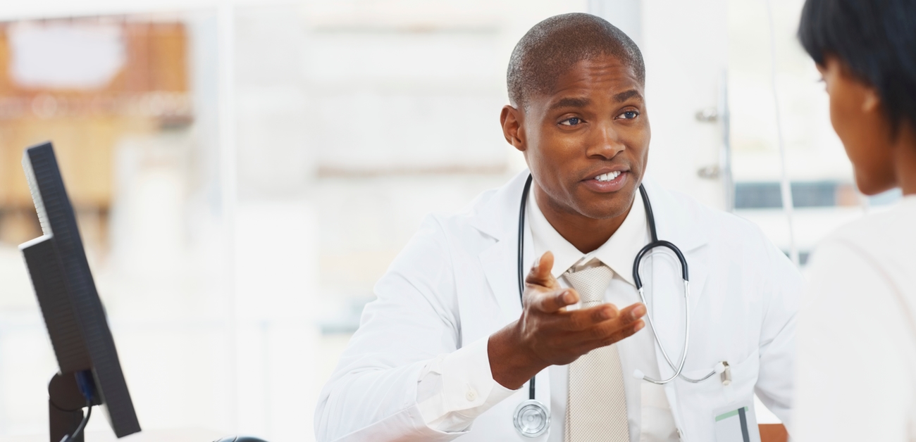 Physician talking with woman