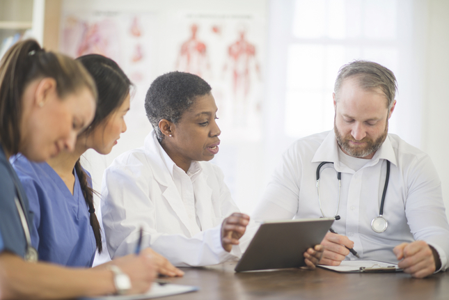 medical staff working with tablet