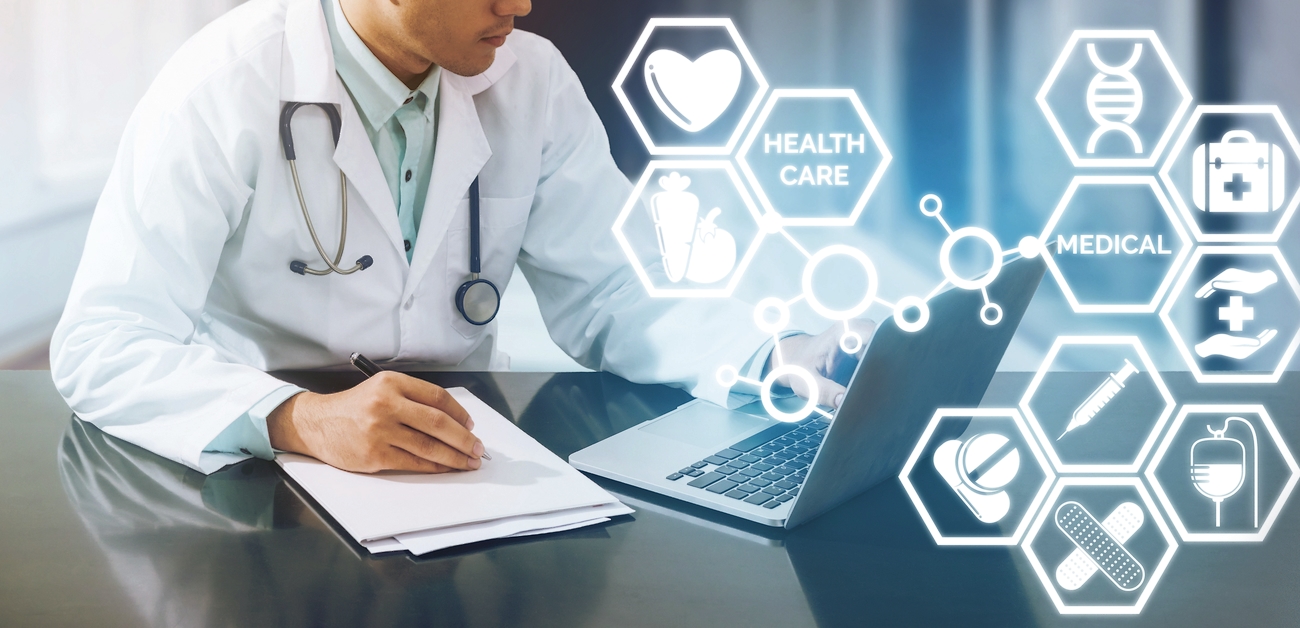 physician working at a laptop computer