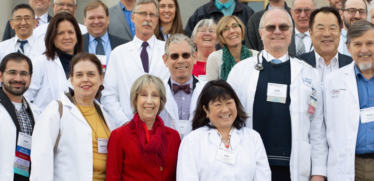 group of smiling physicians posing for photo