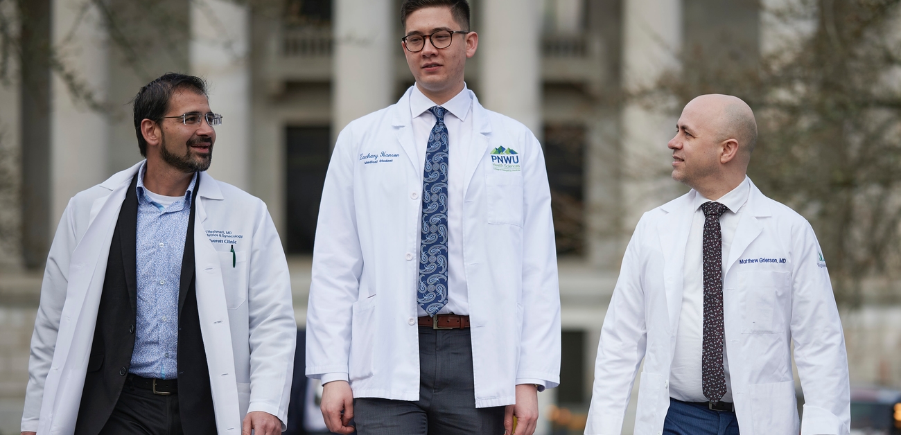 three physicians standing