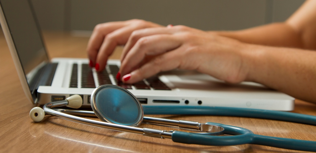 hands typing on a laptop