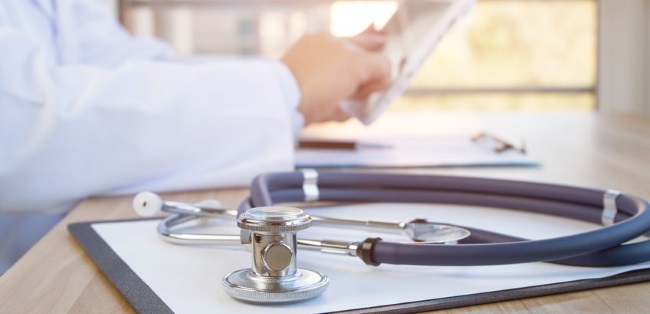 physician reading a document