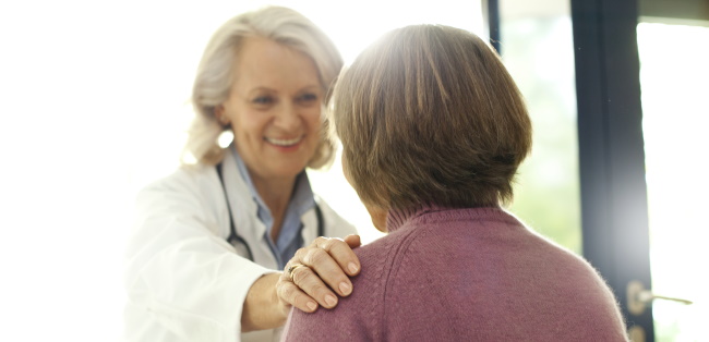 Physician comforting a patient