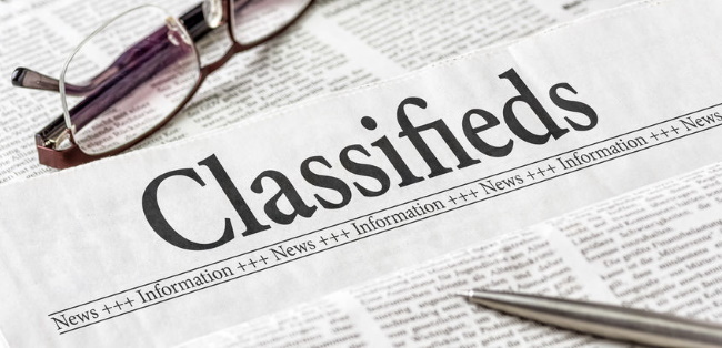 newspaper closeup photo of word Classifieds