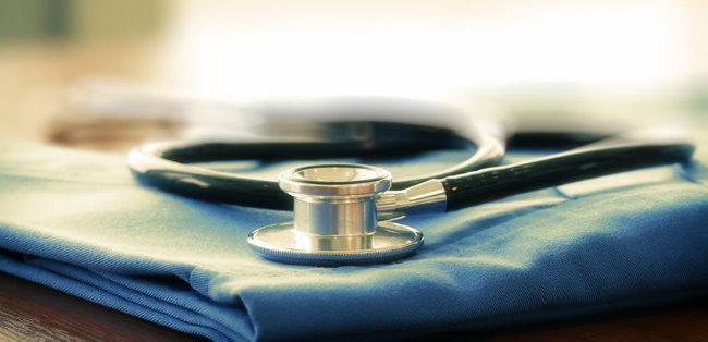 stethoscope lying on a bundle of folded cloth