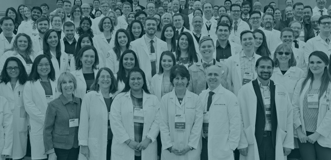 physicians standing in rows on the steps of a building