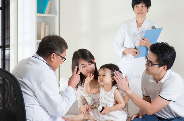 pediatrician with a young patient