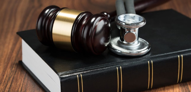 Gavel, stethascope, and book