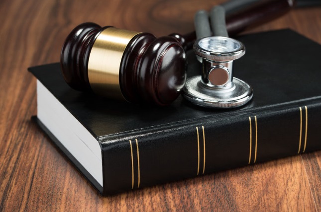 Gavel, stethoscope, and law book